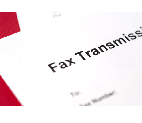 Close-up of paper with words “Fax Transmission” written on it.