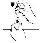 Syringe being used to inject air into vial.