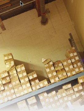 Photo of shelves containing small boxes.